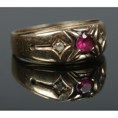 143 - A 9ct gold ruby and paste gypsy style ring. Size T. 5.03g.