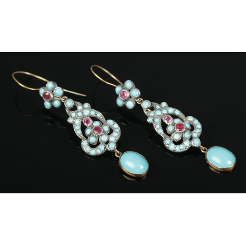 144 - A pair of high carat yellow gold and white metal earrings, set with turquoise and ruby coloured ston... 