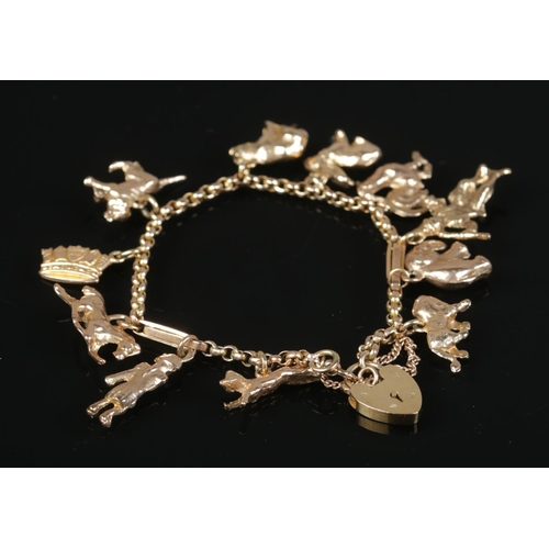 150 - A 9ct gold charm bracelet with various charms, including animals, figures and a crown. 43.54g.