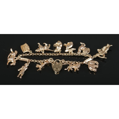 150 - A 9ct gold charm bracelet with various charms, including animals, figures and a crown. 43.54g.