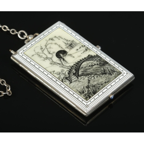 151 - A continental silver and enamel minaudiere. The front decorated with an Oriental landscape scene. Wi... 