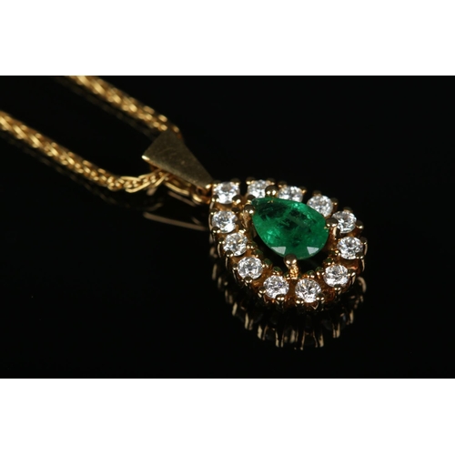 161 - An 18ct gold, emerald and diamond pendant on 18ct gold chain. Chain length 17inches. Emerald approxi... 