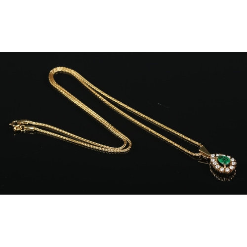 161 - An 18ct gold, emerald and diamond pendant on 18ct gold chain. Chain length 17inches. Emerald approxi... 