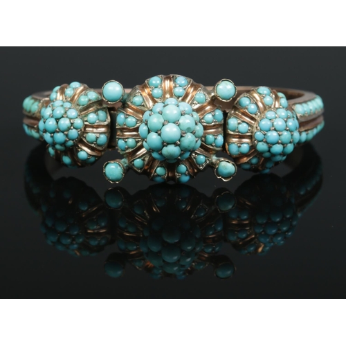 163 - A 19th century yellow metal bangle set with turquoise stones.