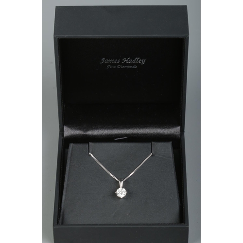 164 - A 18ct white gold and moissanite pendant on 9ct white gold chain. Stone approximately 1ct. Chain len... 