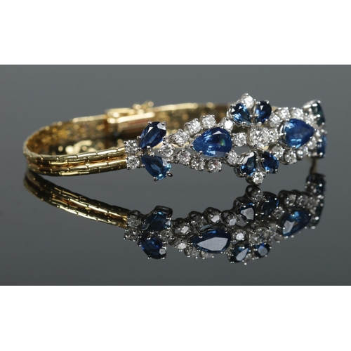 166 - An 18ct gold sapphire and diamond bracelet. Having London import marks, 1984. Length 18cm. 14.83g.