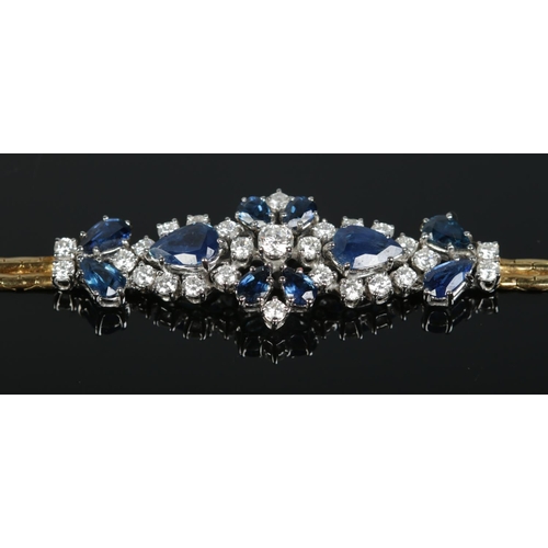 166 - An 18ct gold sapphire and diamond bracelet. Having London import marks, 1984. Length 18cm. 14.83g.