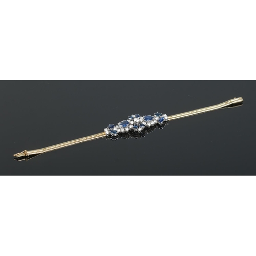 166 - An 18ct gold sapphire and diamond bracelet. Having London import marks, 1984. Length 18cm. 14.83g.