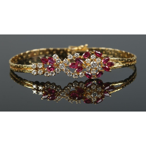 167 - An 18ct gold ruby and diamond bracelet. Having London import marks, 1982. Length 18cm. 15.98g.