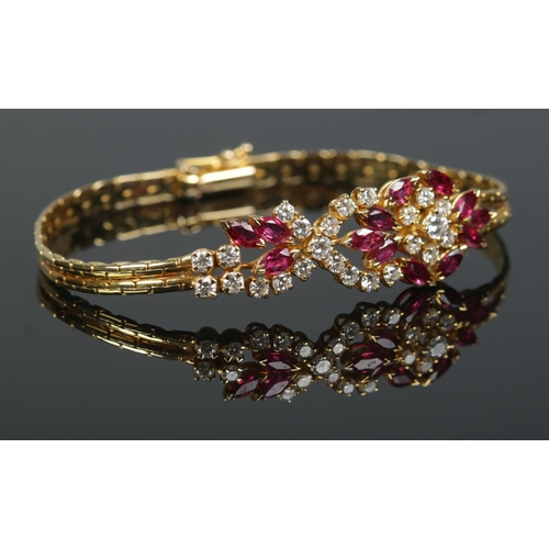 167 - An 18ct gold ruby and diamond bracelet. Having London import marks, 1982. Length 18cm. 15.98g.