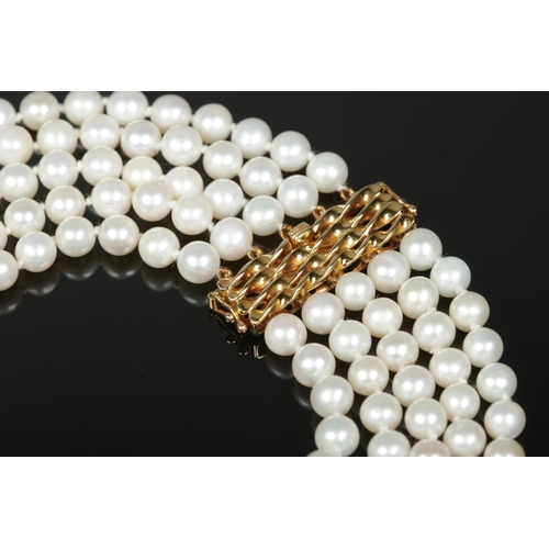 168 - A five row pearl necklace with 18ct gold clasp. The clasp stamped 750 and maker's mark HKJ.