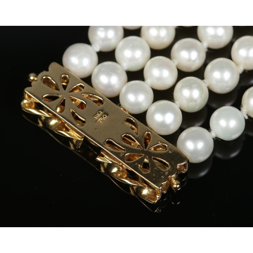 168 - A five row pearl necklace with 18ct gold clasp. The clasp stamped 750 and maker's mark HKJ.