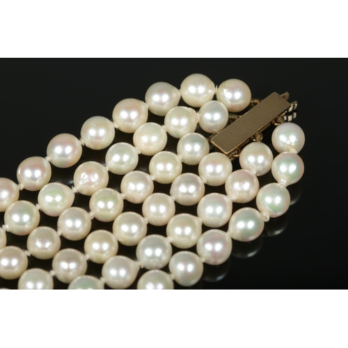 169 - A vintage JKa three row pearl necklace with 9ct gold clasp.