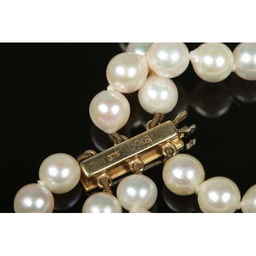 169 - A vintage JKa three row pearl necklace with 9ct gold clasp.