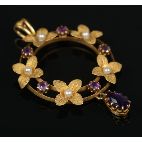 172 - An Edwardian 15ct gold, amethyst and seed pearl pendant with frosted leaf decoration. 2.1g.