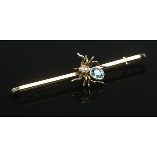 174 - A 15ct gold aquamarine and pearl spider bar brooch. Length 6cm. 3.75g.