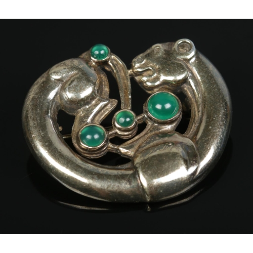 176 - A Georg Jensen style silver leopard brooch set with four cabochon stones. Edinburgh hallmark and PB ... 