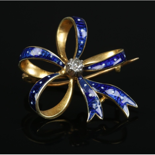 182 - A high carat gold, enamel and diamond bow brooch. 4.29g.