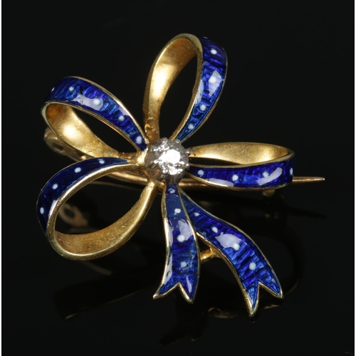 182 - A high carat gold, enamel and diamond bow brooch. 4.29g.