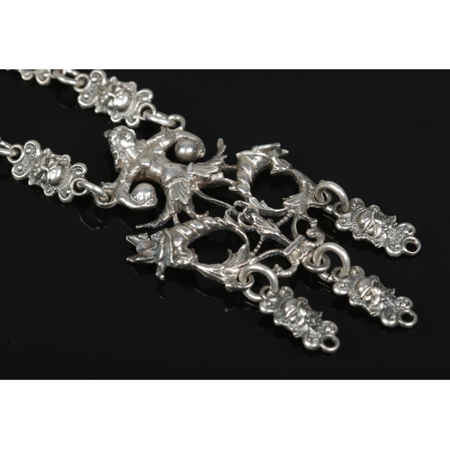 186 - An antique silver chatelaine style necklace, probably Continental. 39.15g.