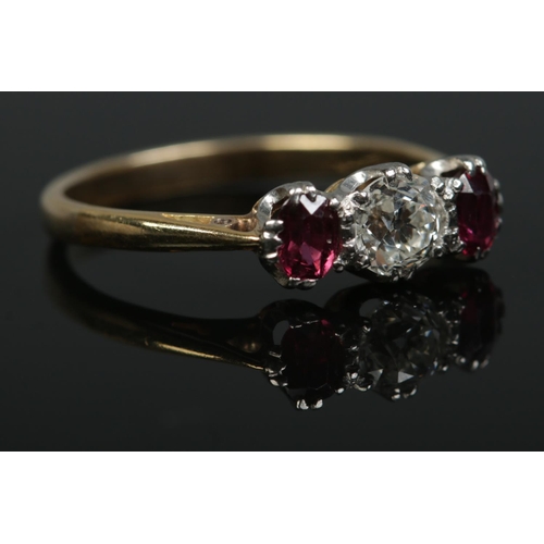 192 - An 18ct gold, diamond and sapphire three stone ring. Size P. 2.65g.