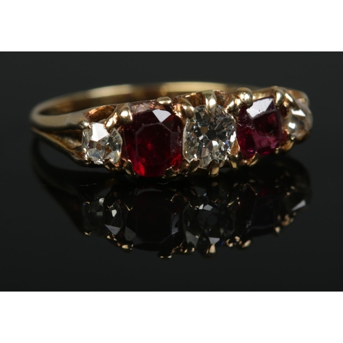 194 - A Victorian 18ct gold, diamond and ruby five stone ring. Size M. Central diamond approx .25ct. 2.63g... 