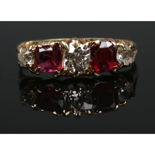 194 - A Victorian 18ct gold, diamond and ruby five stone ring. Size M. Central diamond approx .25ct. 2.63g... 