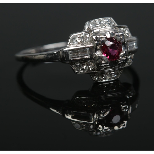 195 - An Art Deco iridium and platinum, ruby and diamond ring. Size P. 3.58g.