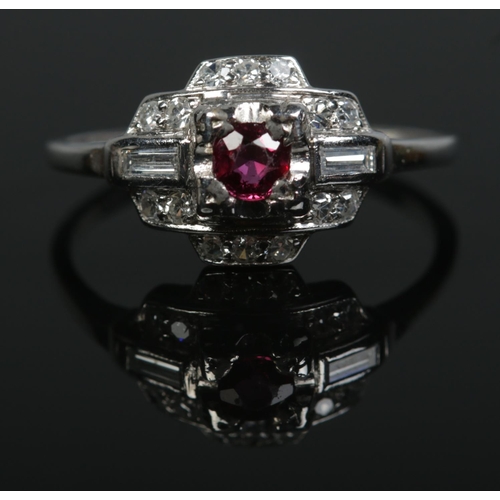 195 - An Art Deco iridium and platinum, ruby and diamond ring. Size P. 3.58g.