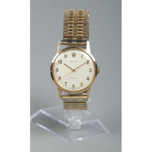 206 - A gents 9ct gold Rolex Precision manual wristwatch on gold plated expanding strap. With guarantee bo... 