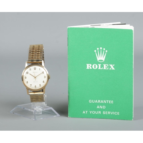 206 - A gents 9ct gold Rolex Precision manual wristwatch on gold plated expanding strap. With guarantee bo... 