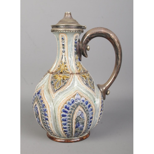 21 - William Parker for Doulton Lambeth, a glazed and incised stoneware ewer with white metal cover and h... 