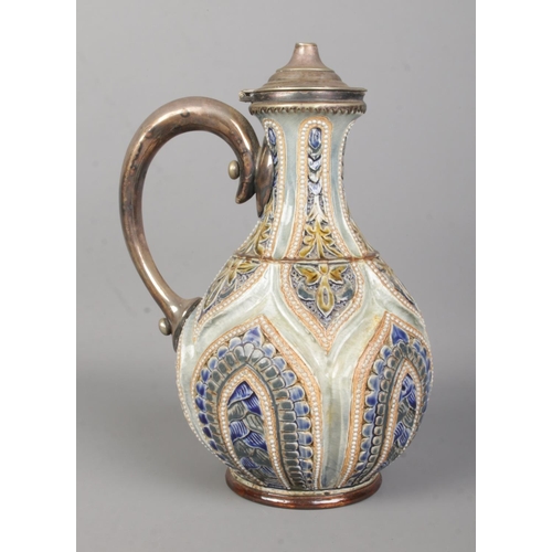 21 - William Parker for Doulton Lambeth, a glazed and incised stoneware ewer with white metal cover and h... 