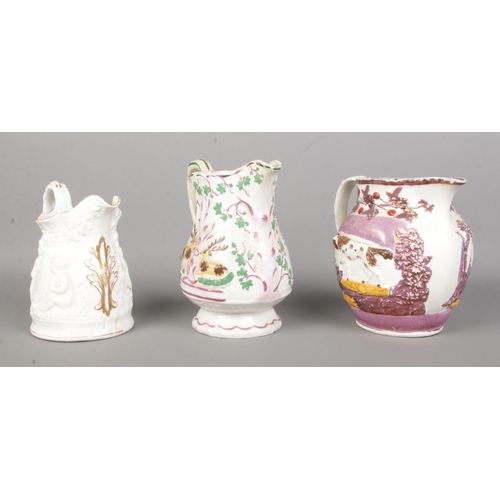 28 - Three 19th century jugs. Includes two lustre hunting jugs and a white glazed example decorated in re... 