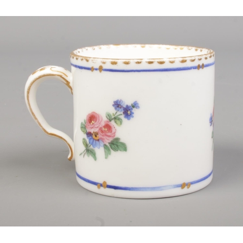 29 - A late 18th century Sevres porcelain coffee cup, handpainted with floral sprays. Height 4.7cm.