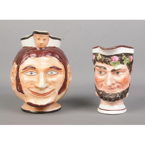 32 - Two 19th century character jugs, one modelled as a Satyr/Bacchus. Tallest 14cm.