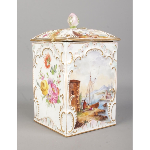 41 - A 19th century porcelain box with cover. With hand painted decoration of landscape scenes and floral... 