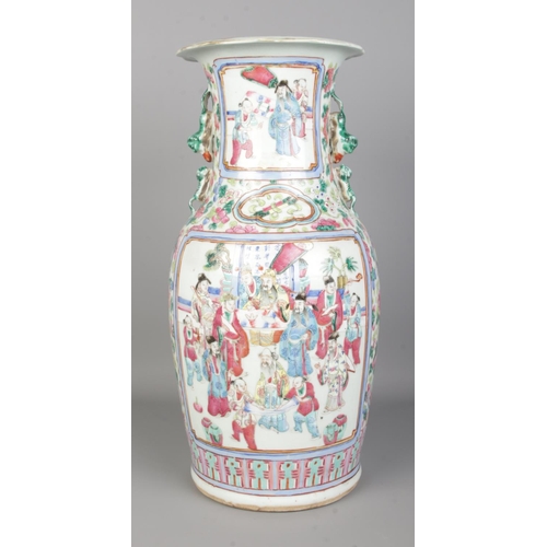 54 - A late 19th/early 20th century Chinese famille rose vase decorated in coloured enamels. Height 45cm.