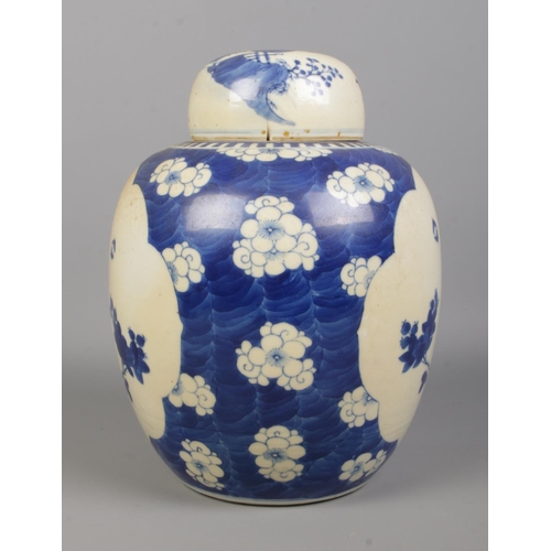 58 - A Chinese blue and white ginger jar decorated with birds and flowers. Having concentric circles to b... 