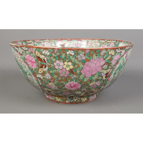 68 - A large Chinese famille rose bowl. Bearing six character Guangxu mark to base. Diameter 31cm.