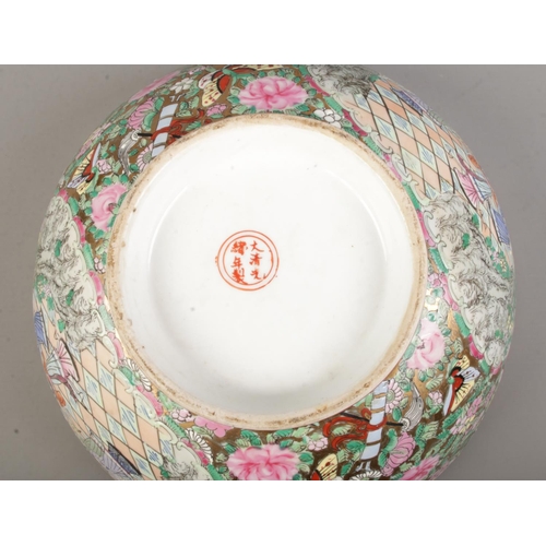 68 - A large Chinese famille rose bowl. Bearing six character Guangxu mark to base. Diameter 31cm.