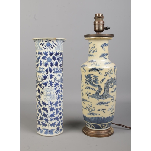 69 - A 19th century Chinese blue and white sleeve vase with four character mark to base along with a simi... 