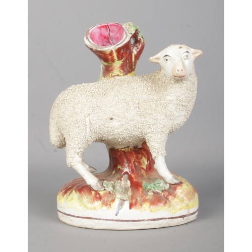 7 - A 19th century Staffordshire sheep spill vase. Height 18cm.