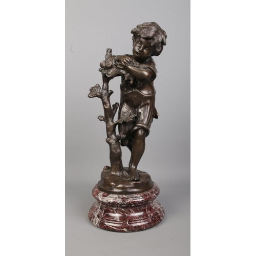 71 - After Auguste Moreau, a bronze sculpture of a boy next to a tree, raised on marble base. Signed to b... 