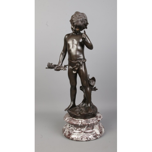 72 - After Auguste Moreau, a bronze sculpture of a boy holding a branch with birds and having a flute at ... 