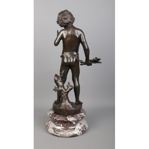 72 - After Auguste Moreau, a bronze sculpture of a boy holding a branch with birds and having a flute at ... 