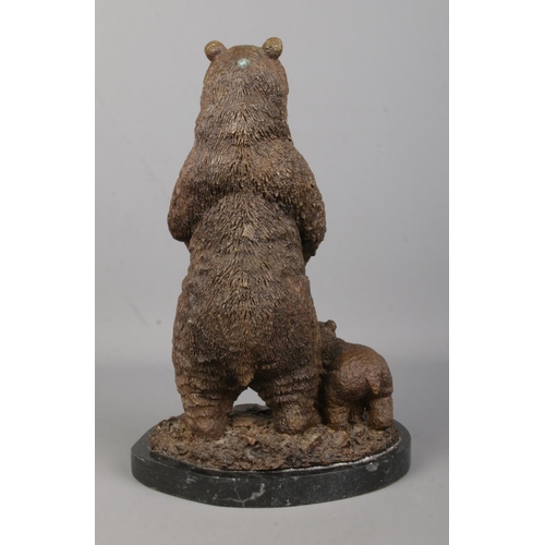 74 - A bronze sculpture modelled as a standing bear with bear cub, on marble base. Signed Mene. Height 31... 