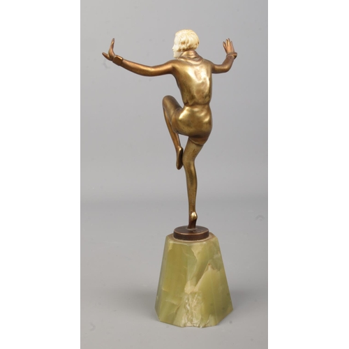 75 - Josef Lorenzl (1892-1950), a bronze and ivory figure, modelled as a dancer, raised on onyx base. Hei... 