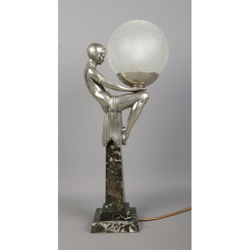 76 - After Max Le Verrier (1891–1973), an Art Deco style table lamp formed as a female figure in a seated... 