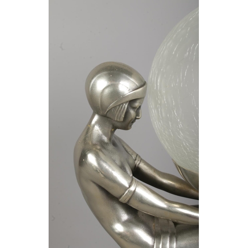 76 - After Max Le Verrier (1891–1973), an Art Deco style table lamp formed as a female figure in a seated... 